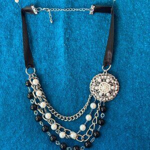 3 strand necklace/white beads/black beads & silvertone metal st. and a medallion